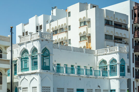 Traditional and modern arab white buildings with decorated windows and balconies, Mutrah, Muscat, sultanate Oman