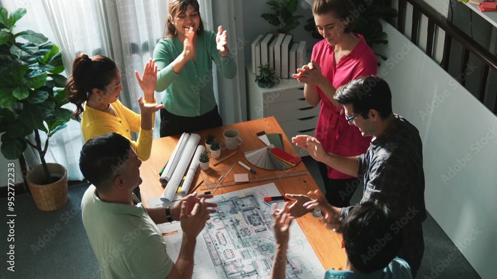 Poster top view of smart civil engineer team clapping hand while discussing idea at meeting table with blue