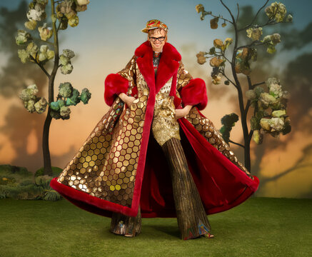 models for luxury fashion line , wearing, gold and red, sequins, pop, beautiful, with hexagon pattern, retro vintage 1960, 1970, crossdressing community