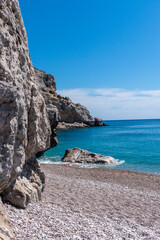 Beach, sea and rocky coast on the island of Rhodes in Greece