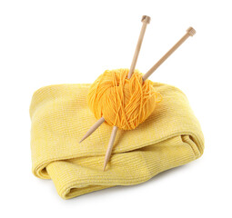 Ball of yarn with knitting needles and sweater isolated on white