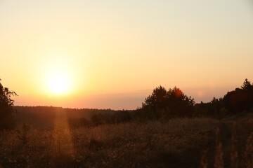 Beautiful view of sky over meadow at sunrise in morning