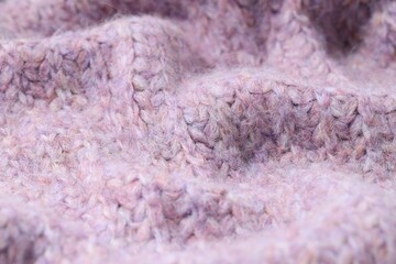 Texture of bright knitted fabric as background, closeup