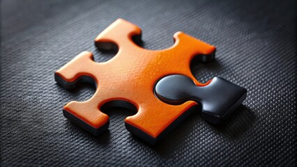 Fototapeta premium Close up of a black and orange puzzle piece, puzzle, piece, jigsaw, solve, challenge, fit, complete, game, solution