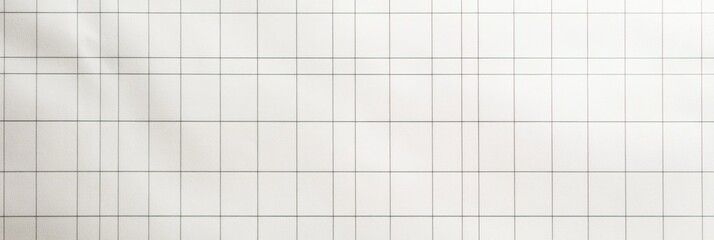 A grid paper texture fills the view, highlighted by soft shadows that enhance its depth. The clean background offers a versatile canvas for creative projects and design purposes