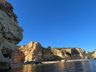 Oddly shaped jagged rock formations and cliffs at Lagoa Beach, Faro District, Southern Portugal.