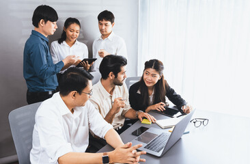 Group of diverse office worker employee working together on strategic business marketing planning in corporate office room. Positive teamwork in business workplace concept. Prudent