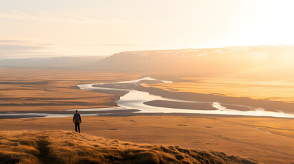 Person Standing on the Edge of an Open Plain Overland – Exploring Nature and Adventure