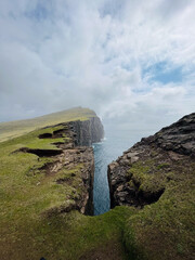 S&oslash;rv&aacute;gsvatn, lake hanging above an ocean, Faroe Islands