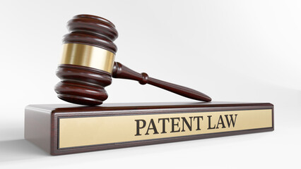 Patent Law: Judge's Gavel as a symbol of legal system and wooden stand with text word