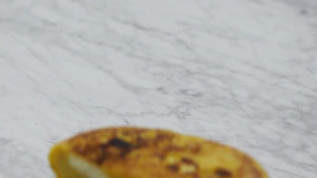 Delicious just grilled sweet yellow corn hand made arepa de chocolo.