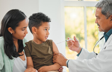 Pediatrician, woman and child with injection, health and vaccine for growth or development in clinic. Mother, boy and doctor with needle at hospital for immunity, routine check and illness prevention