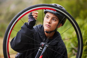Wheel, check and woman with bicycle for outdoor adventure, fitness and maintenance inspection for...