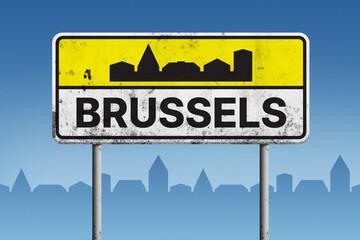 Vintage road sign of Brussels with black urban skyline silhouette, representing city entrance and a...