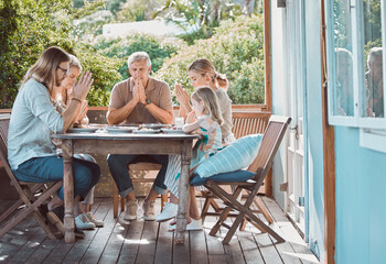 Lunch, backyard and family in prayer together with gratitude, faith and weekend gathering event at...