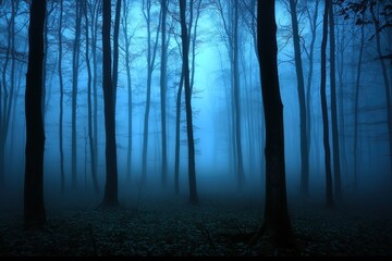 Fototapeta premium Spooky forest with tall trees shrouded in dense blue fog during twilight, creating a mystical, eerie atmosphere.