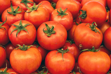 Fresh tomatoes on market stands