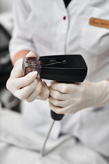 Professional using a device for skin treatment in a clinical setting