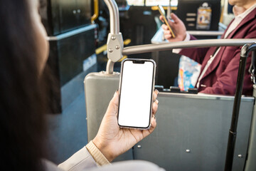 Girl on bus holding a phone