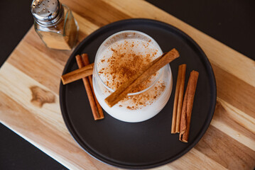 Horchata with cinnamon and coffee in a glass in Coffee Shop