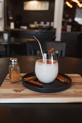 Horchata with cinnamon and coffee in a glass in Coffee Shop
