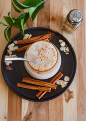 Horchata with cinnamon and coffee in a glass in Coffee Shop