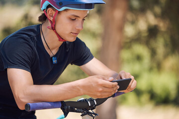 Fitness, bicycle and man with phone online for training, adventure and exercise in nature. Sports,...