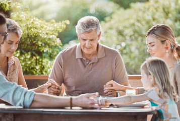 Lunch, outdoor and family in prayer at table together with gratitude, faith and weekend gathering...