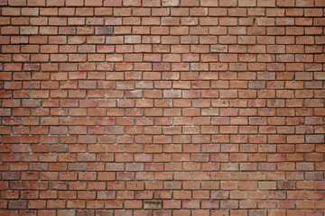 A high-resolution image of a rustic red brick wall. 
