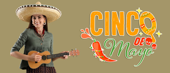 Beautiful woman in sombrero hat and with guitar on green background