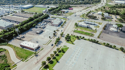 Large vacant parking space near industrial manufacturing zone South of Arlington, Texas, warehouse, fulfilment center in rapidly developing supply chain hub logistic, established business, aerial
