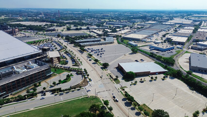 Industrial warehouse space near entertainment district in manufacturing zoning South of Arlington, Texas, rapidly developing supply chain hub logistics in established business community, aerial