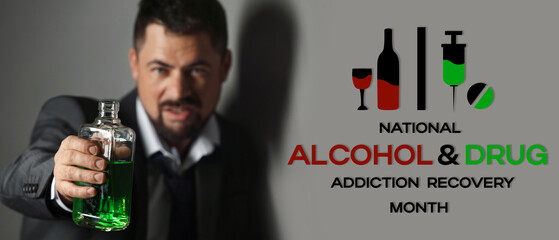 Businessman with absinth near grey wall. Concept of alcoholism