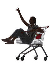 Silhouette of young woman sitting in shopping cart on white background