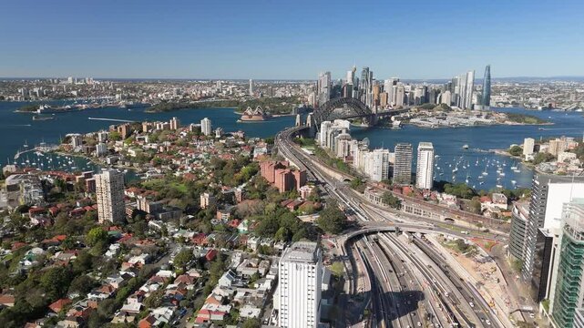 Aerial drone view of Sydney City, the Sydney Harbour and the Harbour Bridge above Cahill Expressway, NSW, Australia on a sunny day in August 2024