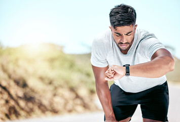 Outdoor, man and fitness with digital watch to monitor or tracking health, wellness and wellbeing. Male person, water bottle and sweat in road with checking running results, heart rate on app