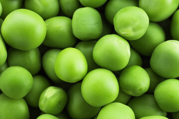 Fresh green peas as background, top view