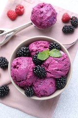 Delicious blackberry sorbet, mint and fresh berries on grey table, flat lay