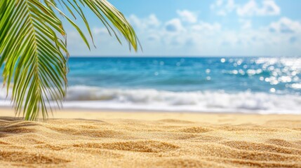 A tranquil beach scene with soft sand, gentle waves, and a palm leaf in the foreground.