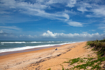 beach, lonely with rough surf and clouds