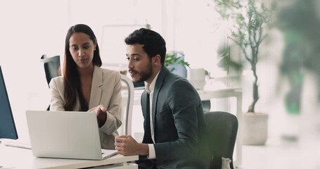 Two business partners met in office review contract details, terms and conditions, watching and discuss online presentation sit at desk using laptop, take part in negotiations, planning cooperation