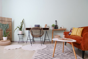 Interior of living room with tables and houseplants