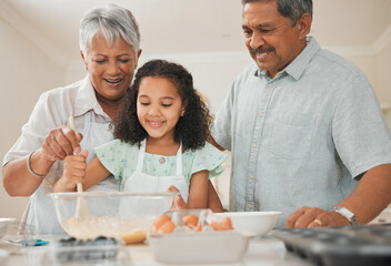 Mixing, child and grandparents with baking in kitchen for helping, learning and teaching cake recipe in home. Family, senior people and girl kid with raw ingredients for cooking education and support