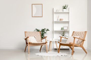 Interior of modern stylish living room with armchairs and shelving unit