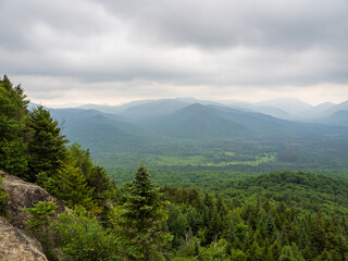 View from summit of Mt. Van Hoevenberg with haze over Adirondack Mountains wilderness, outside Lake Placid, New York State.