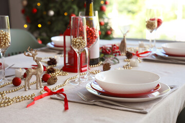 Christmas table setting with beads in room, closeup