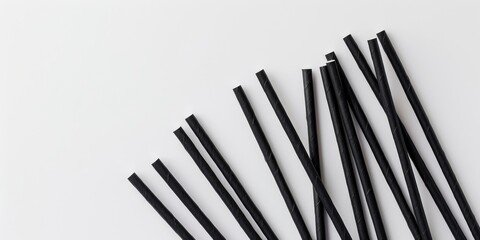Sustainable Dark Paper Straws on a Light Surface