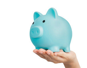 Hand holding blue piggy bank for saving money on white background.