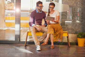 Small business, tablet and people with discussion by cafe for restaurant, support and online sales system. Bakery, owner and partner with tech for order information, management or digital menu update