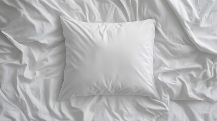 A White Pillow on a Crisp White Bed